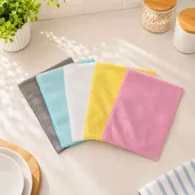Stacked wood fiber dishcloths showing bulk order color and edge consistency.